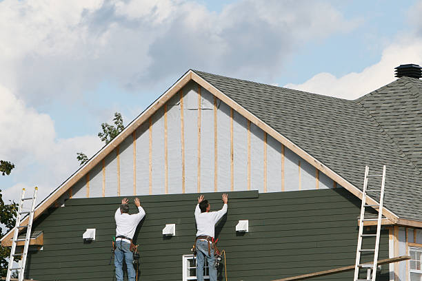 Professional Storm Damage Siding Repair technician working in Cable, OH
